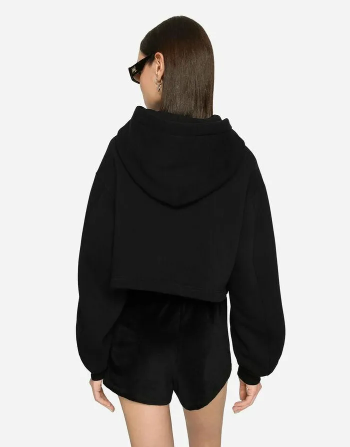 Dolce and Gabbana TShirts And Sweatshirts Women Cropped Jersey Hoodie With Embroidered DG Patch Black Dolce and Gabbana TShirts And Sweatshirts Women Cropped Jersey Hoodie With Embroidered DG Patch Black