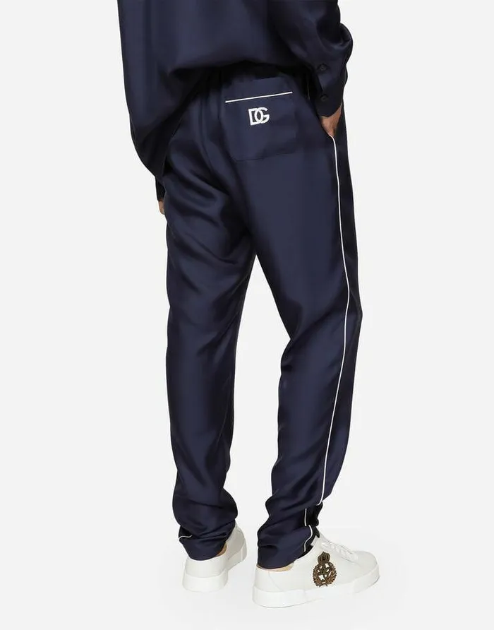 Dolce and Gabbana Trousers And Shorts Men Silk Jogging Pants With DG Embroidered Patch Blue Dolce and Gabbana Trousers And Shorts Men Silk Jogging Pants With DG Embroidered Patch Blue